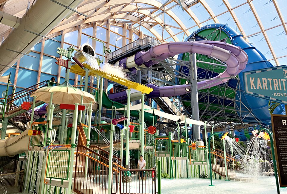 The indoor water offers thrill slides, dumping buckets, and toddler splash pads.