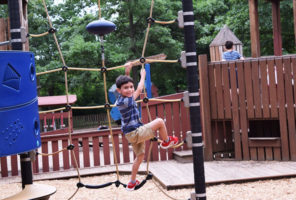 Climb the ropes at KidStreet Playground. Photo by  Kaylynn Chiarello Ebner