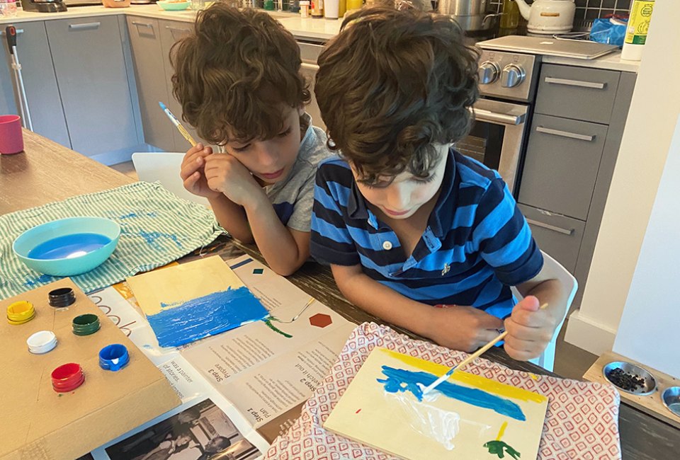 Kids can while away hours of a day with a set of watercolors and a stack of new paper for painting. Photo by Sara Marentette