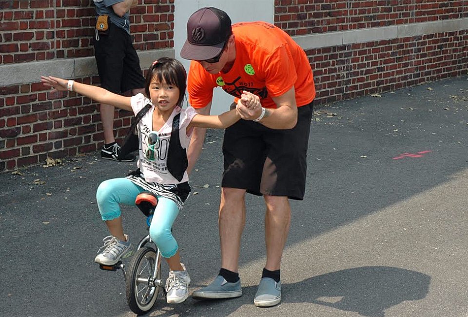 The NYC Unicycle Festival returns for a 13th running with single-wheeled fun popping up all over town. Photo courtesy of the Bindlestiff Family Cirkus 