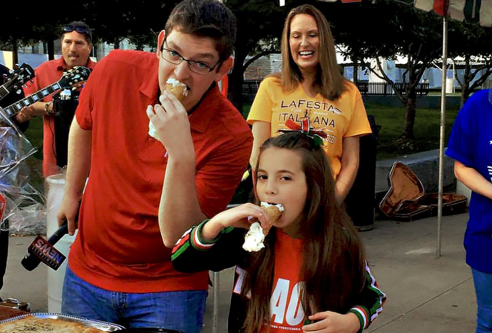 Indulge in a giant cannoli at the La Italia Fest.