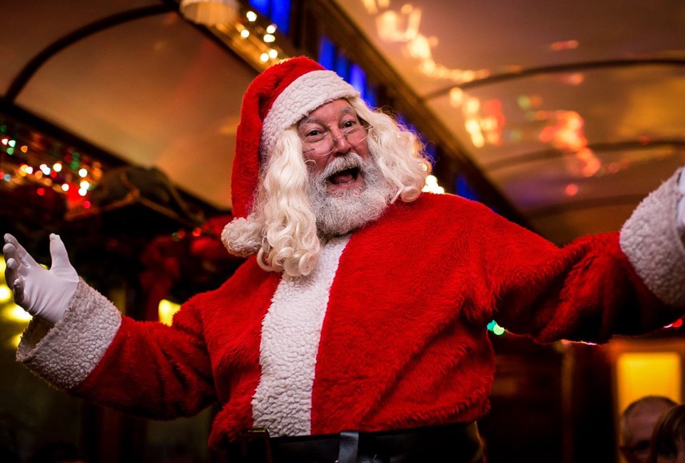 Santa greets families on the daytime Santa Express and the evening Northern Lights Limited Christmas trains. Photo courtesy of the Naugatuck Railroad