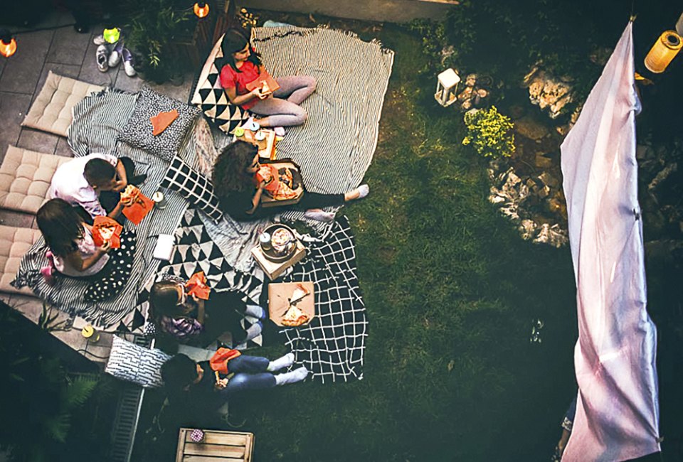 Everything you need (at every price point) for a perfect backyard movie night! Photo courtesy of Canva