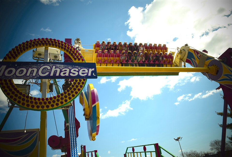 The thrilling Moon Chaser spins, twists, dips, and inverts riders at heights up to 45 feet in the air.