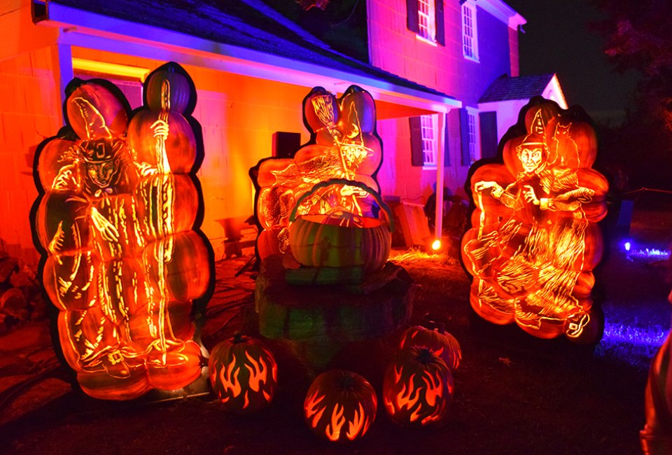 The Great Jack-o'-Lantern Blaze features hand-carved jack-o’-lanterns in elaborate displays at Old Bethpage Village Restoration. Photo by Jaime Sumersille