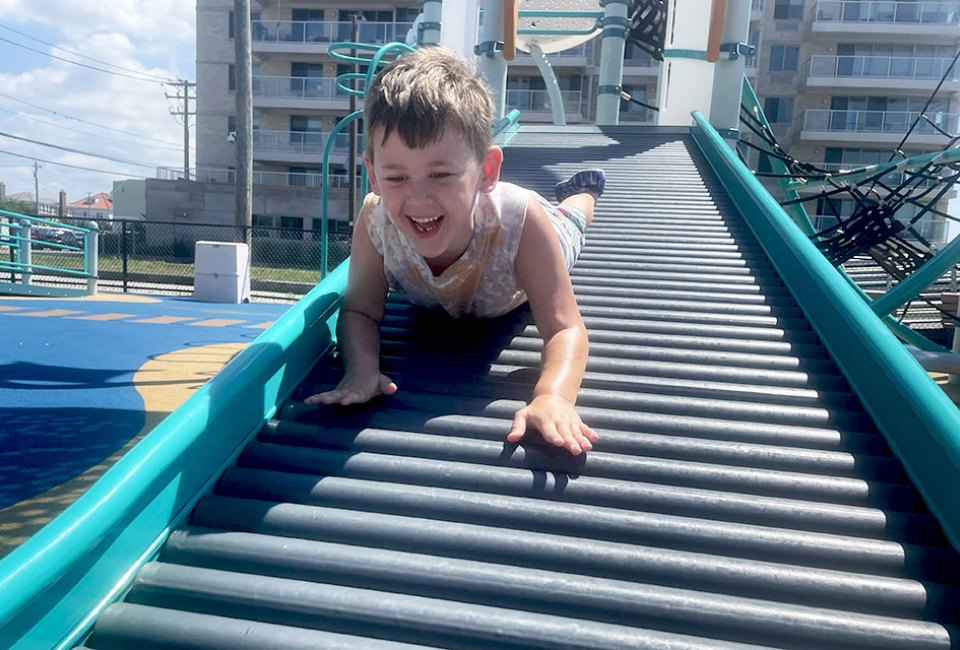 Dive headfirst down the rolling slide, one of Magnolia Park Playground's unique features.