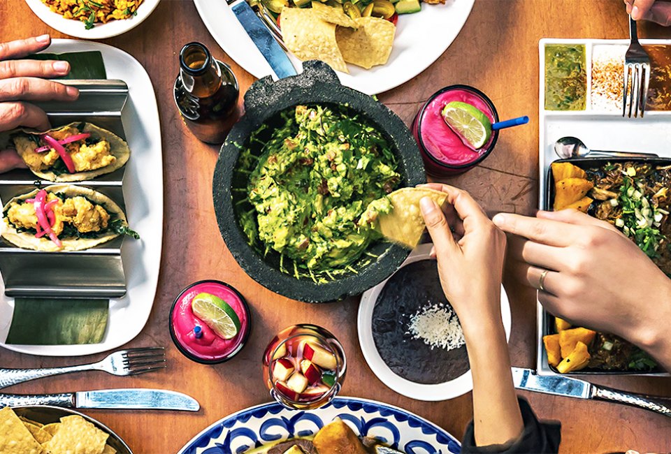 Dig into guac, beans and chips at Rosa Mexicano. Photo courtesy of the restaurant