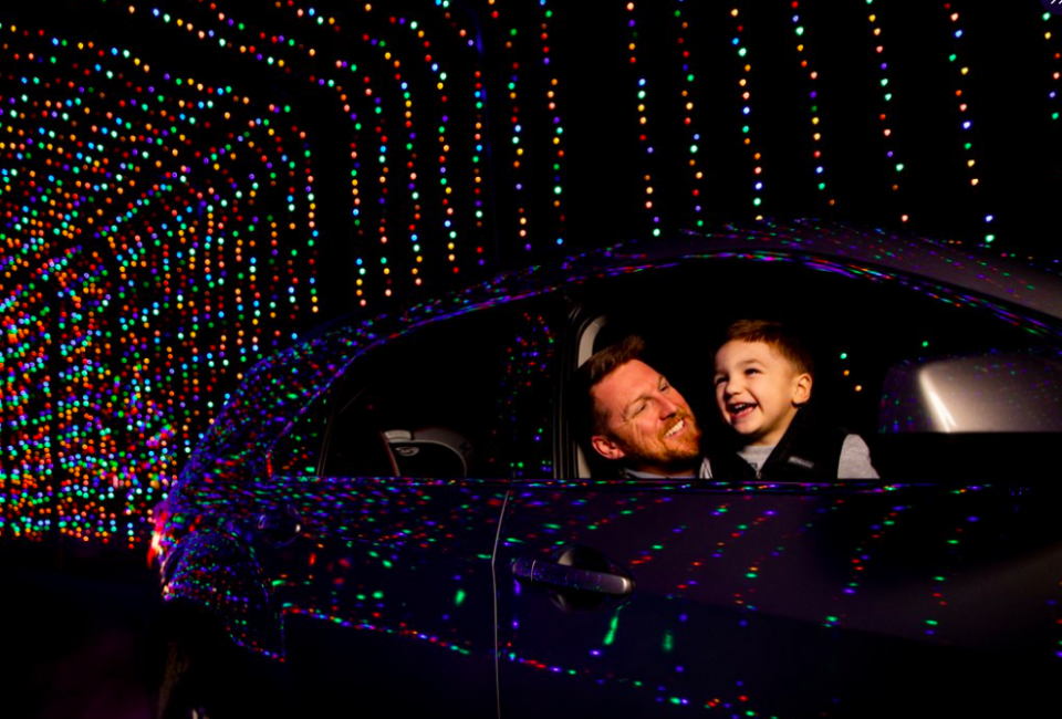 The one-mile long Magic of Lights drive-thru features glowing tunnels and digital animation.