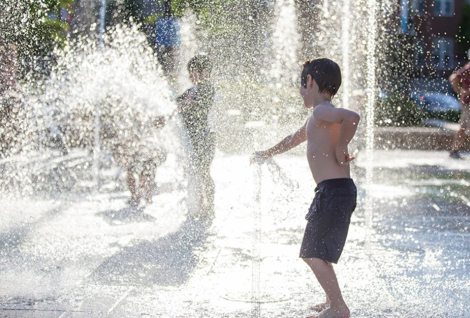 Head to City Springs City Green for a romp through the refreshing splash pad. Photo courtesy of City Greene