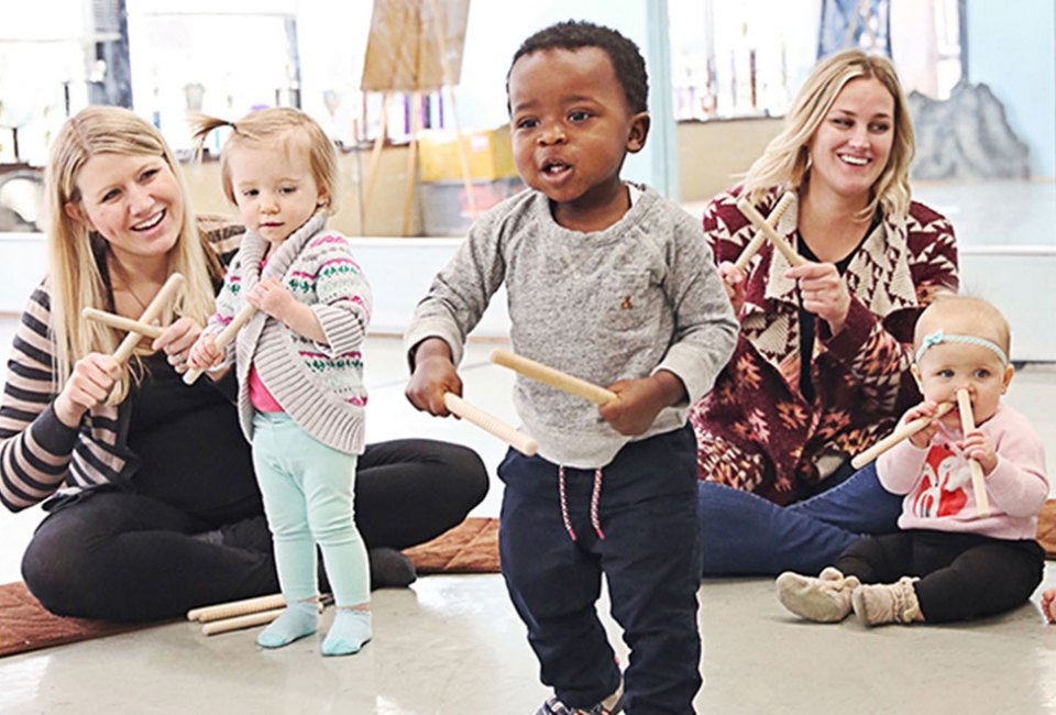 Caregivers and kids dance and sing at Music Together. Photo courtesy of Music Together