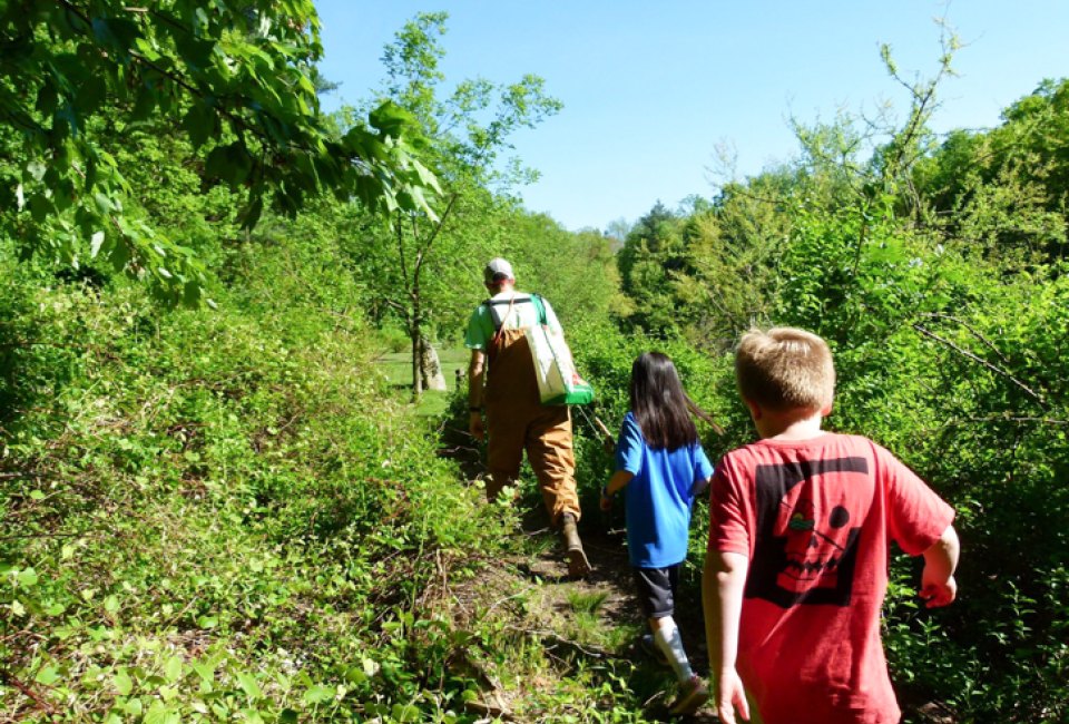 Photo of children walking on a trail at one of CT's afterschool programs.