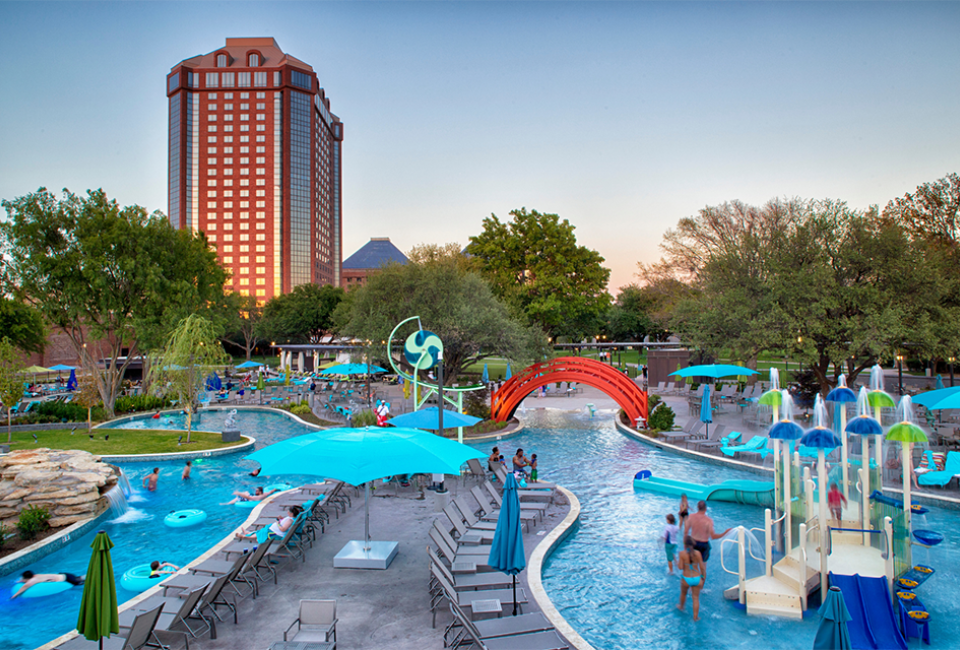 Discover an outdoor pool complex with slides, a lazy river, and dining options kids will love at the Hilton Anatole.