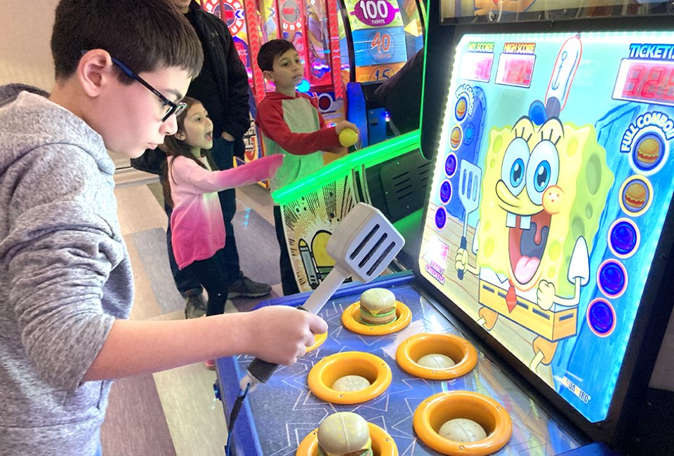 Whack a Krabby Patty on the SongeBob SquarePants game at Fundaes. 