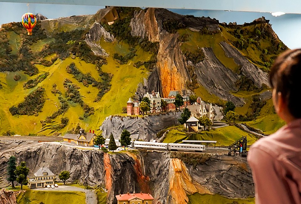 boy looking at model trains Northlandz