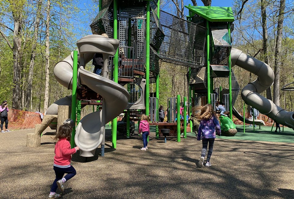 The towering new playground structure at Nomahegan Park packs tons of fun with its twisty slides, wobbly bridge, and tons of challenging climbing structures. 