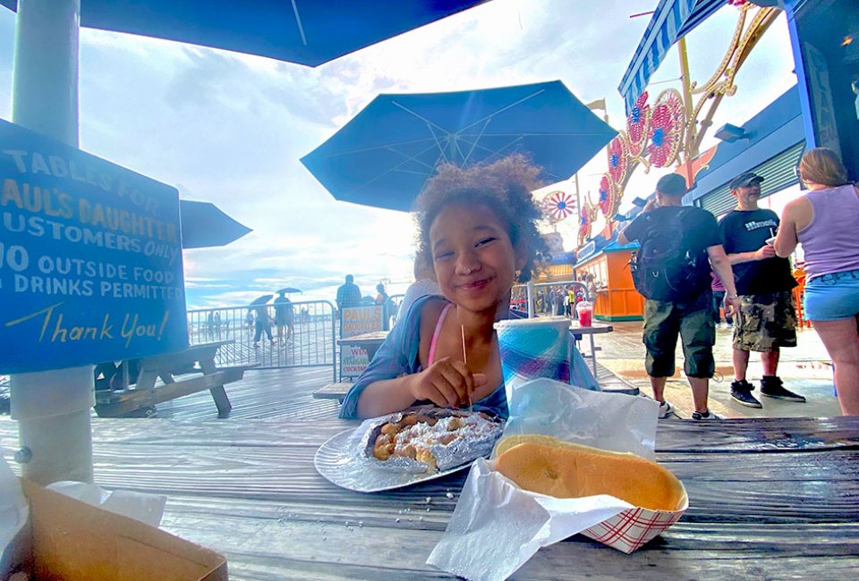 Noshing on a funnel cake on the Coney Island boardwalk is a sweet ending to an epic day of summer fun. 