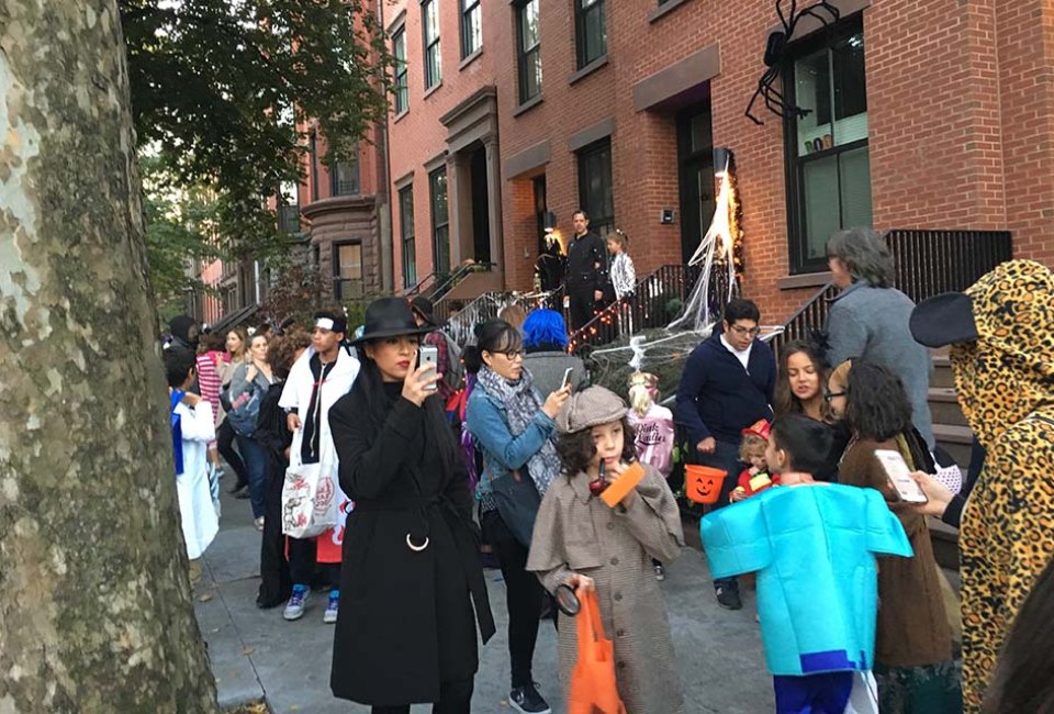 trick-or-treaters on the street of Brooklyn