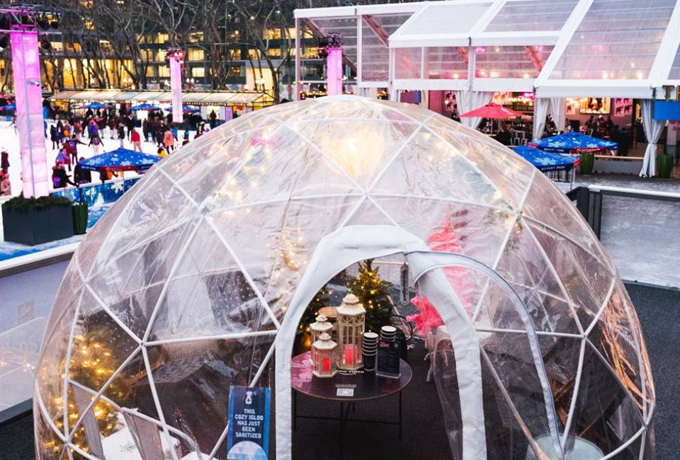 Revel with the family in your own private igloo at Bryant Park's Winter Village. Photo by Kevin Ornelas 