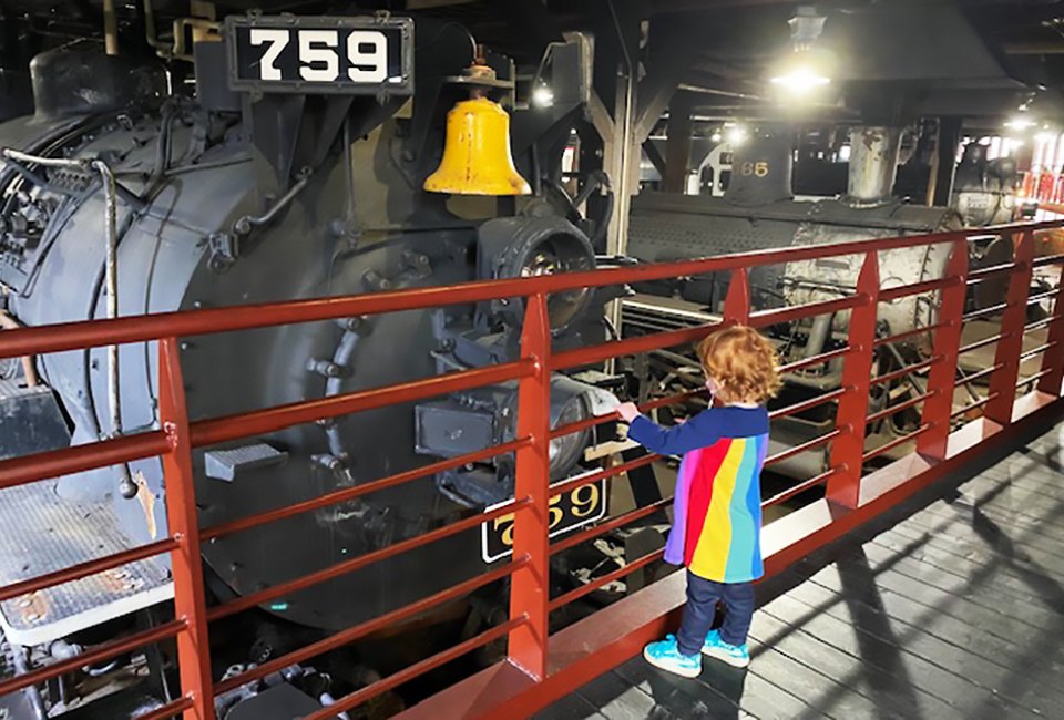 Train-lovers of all ages love to explore the roundhouse at Steamtown. 