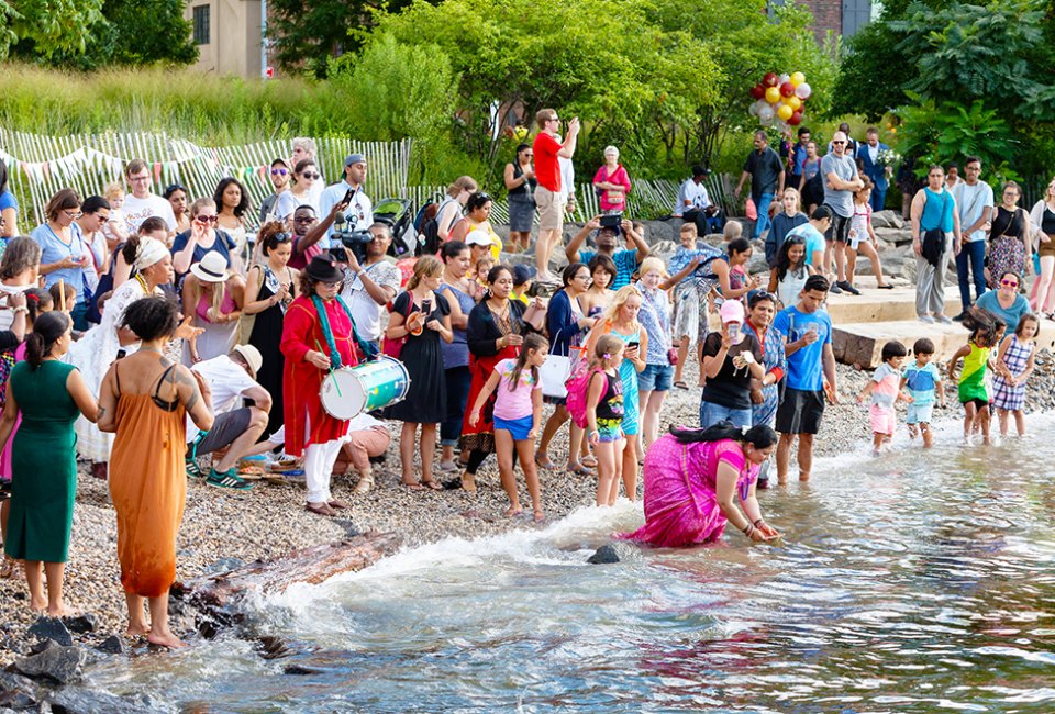 The 12th annual Aarti Hindu Lamp Ceremony returns to Brooklyn Bridge Park's Pebble Beach! Photo by Etienne Frossard