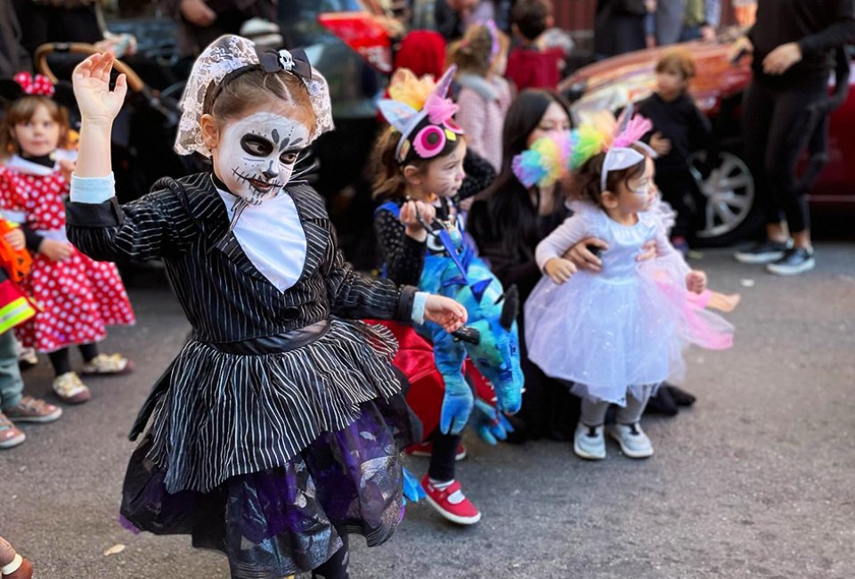 Costumed kids and kids-at-heart march down Brooklyn's Manhattan Avenue in the Greenpoint Halloween Parade & Party. Photo courtesy of Town Square BK