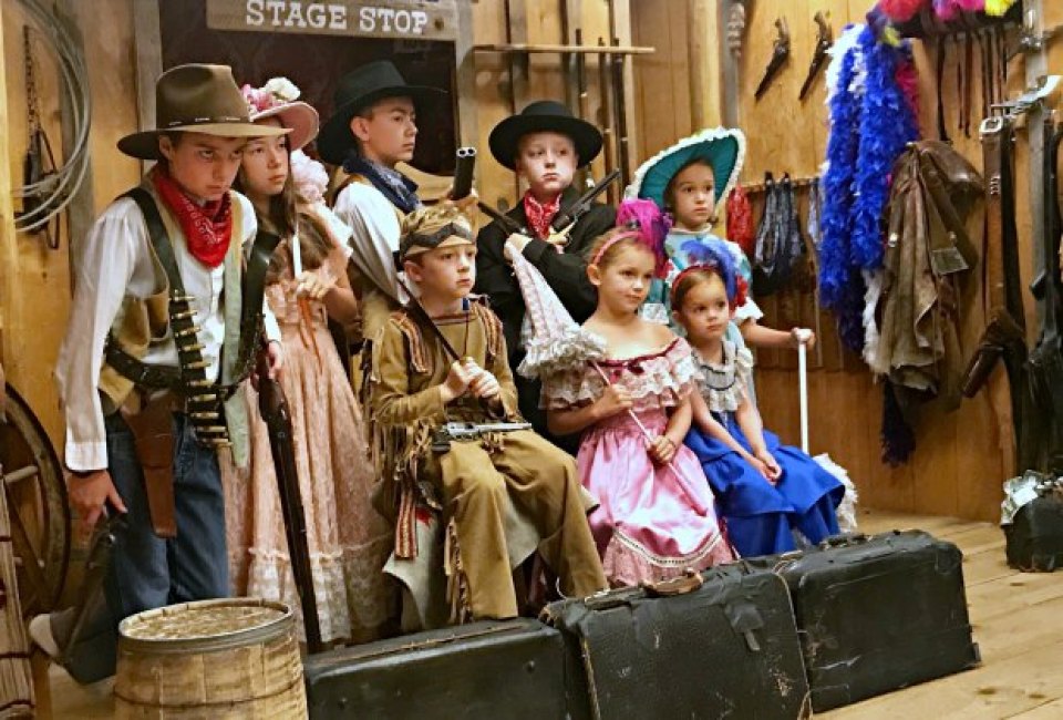 Kids play dress up at an old-time photo studio in Jackson Hole, Wyoming