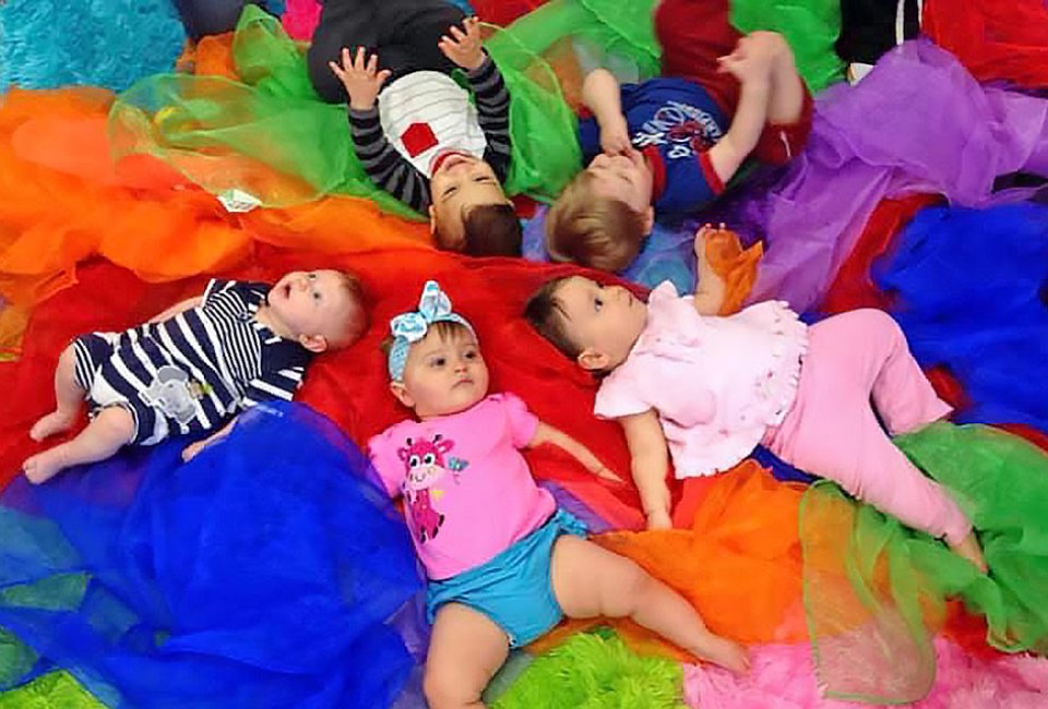 Babies experience colorful, sensory play at A Kids Gym.