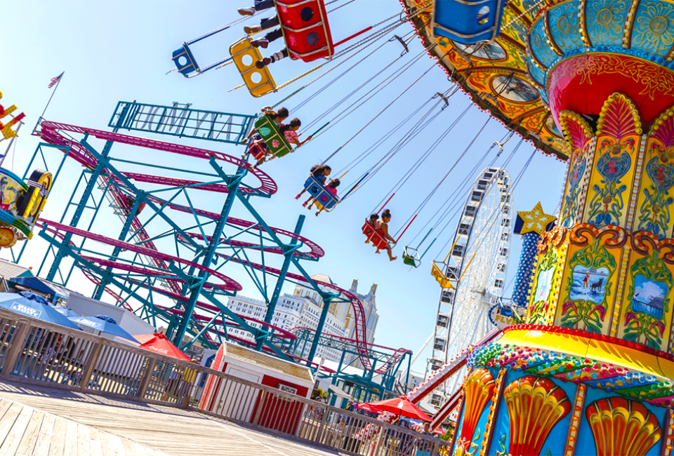 Hop on the nostalgic rides located right on the boardwalk in Daytona Beach. Photo courtesy of Mommy Poppins