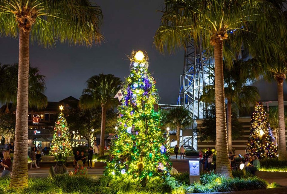 The holidays have arrived at Disney Springs! Stroll through the Tree Trail and nightly snow flurries for free. Photo courtesy of Disney