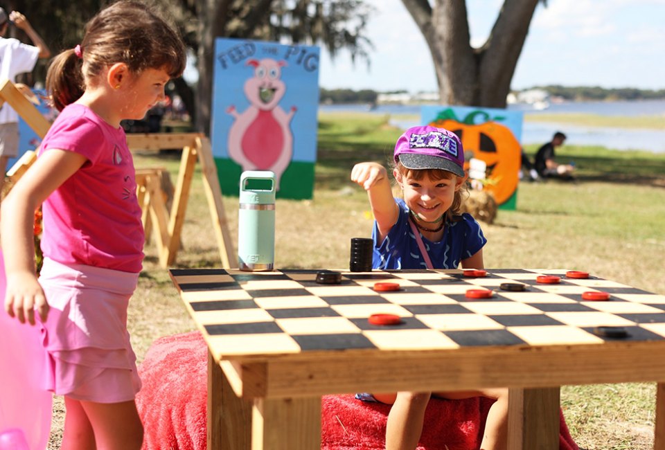 Pig on the Pond is an annual community event featuring carnival rides, kids zone, BBQ competition, and more. Photo courtesy of the event