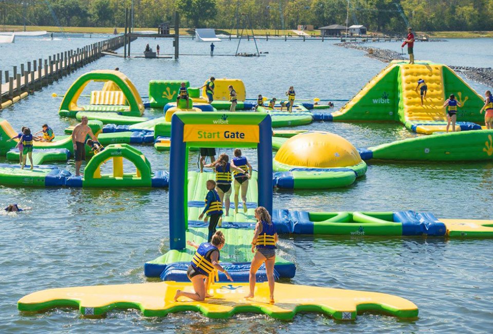 Hit the obstacle course at these inflatable Orlando water parks. Photo courtesy of The Orlando Watersports Complex