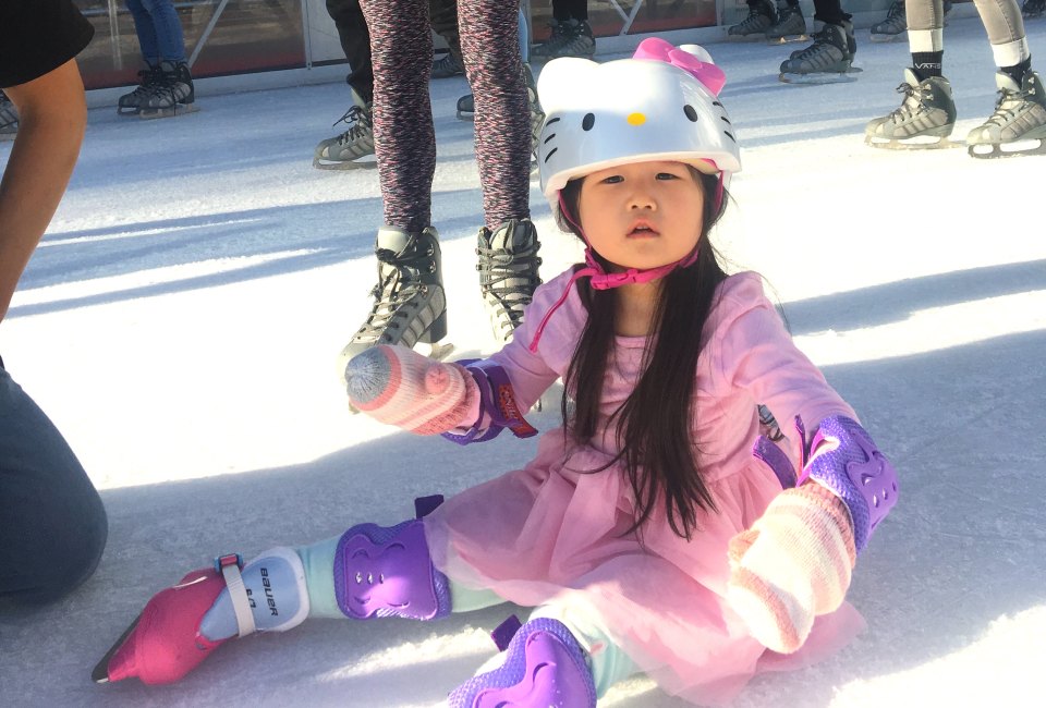 Seasonal Ourdoor Ice Skating Rinks in Los Angeles: Little Girl Sititng on the Ice