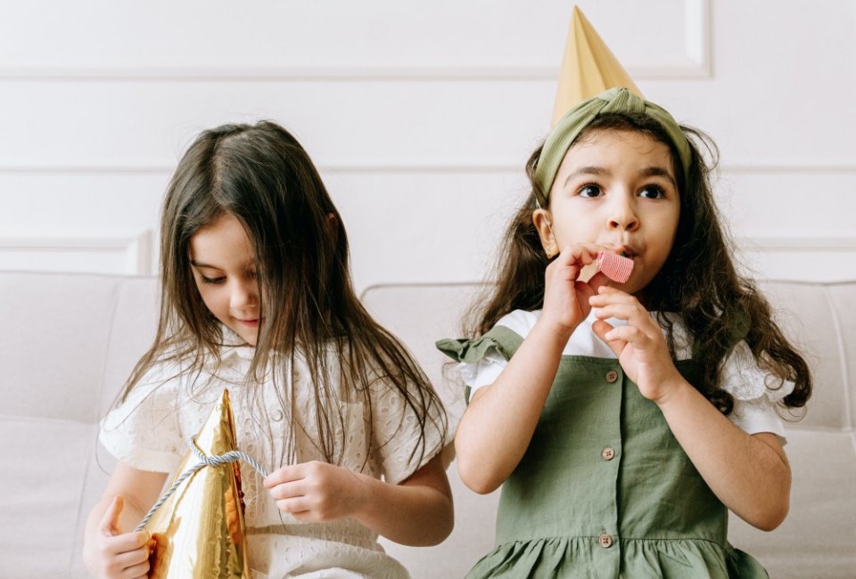 Noisemakers and party hats make the evening feel festive from the start! Photo by Ivan Samkov via Pexels