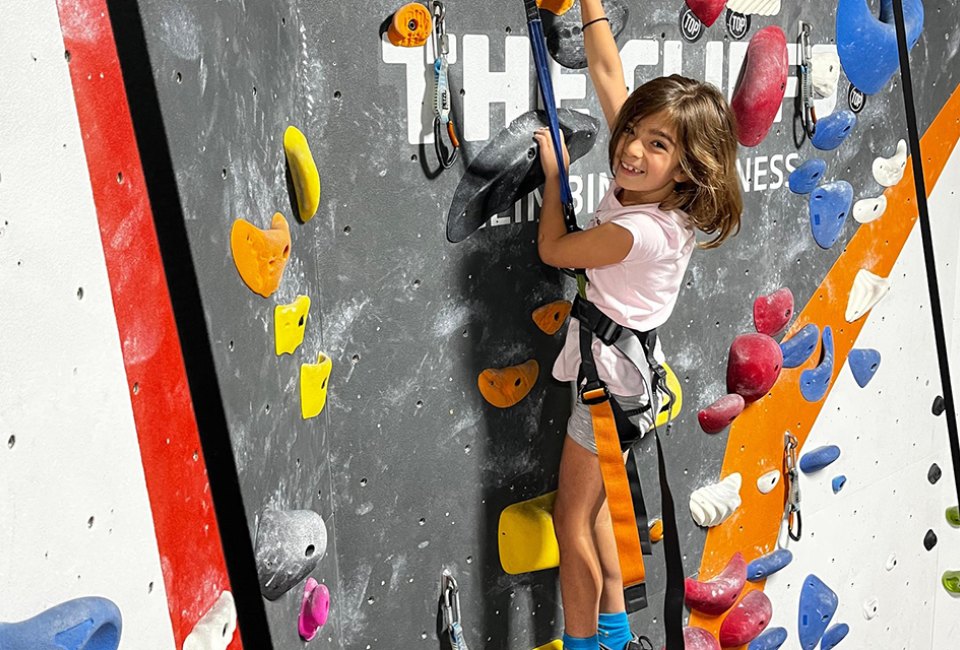The climbing wall at The Cliffs at Callowhill challenges kids to climb to new heights. 