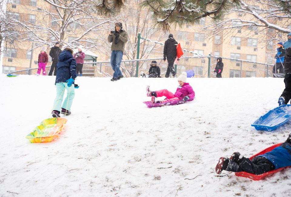 Kids enjoy sledding on a hill off Kelly Drive. Photo courtesy of Philadelphia Parks and Recreation