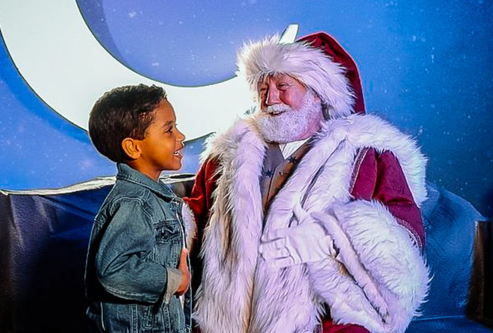 Meet Santa amid dazzling lights. Photo courtesy of Enchant Christmas 