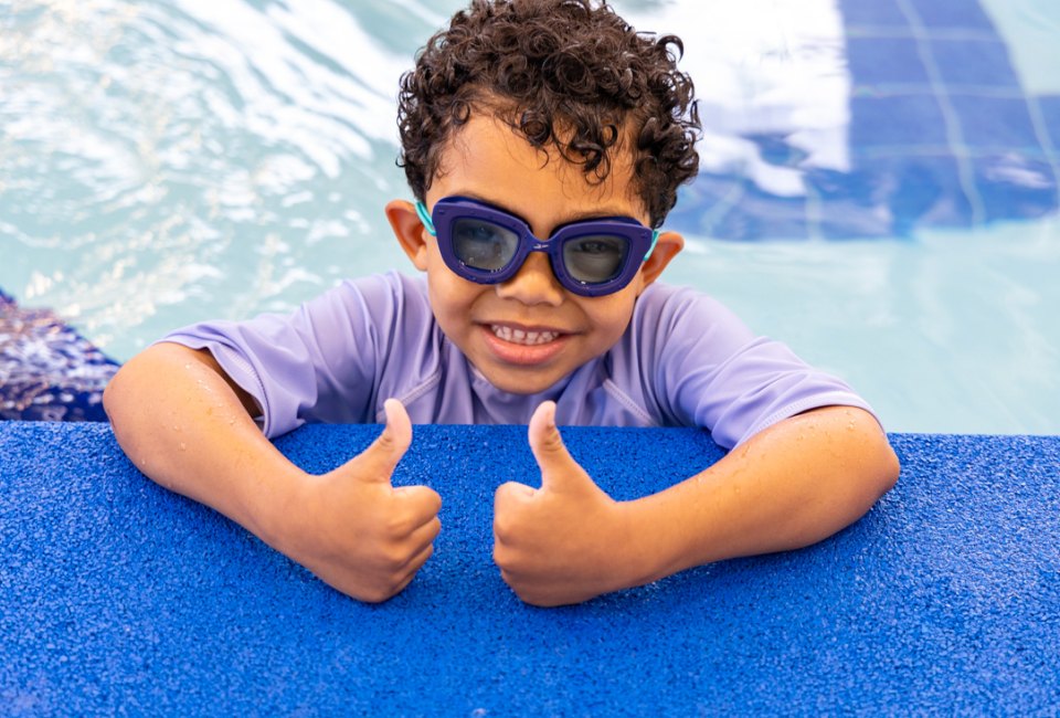 Two thumbs up for water safety! Photo courtesy of SafeSplash Swim School