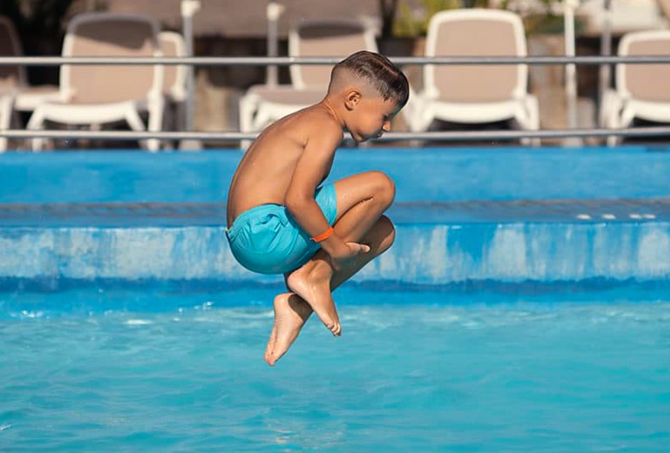 Cannonball! Make some fun summer memories at swimming pools and spray grounds around Boston this summer. Photo courtesy of the Waltham YMCA