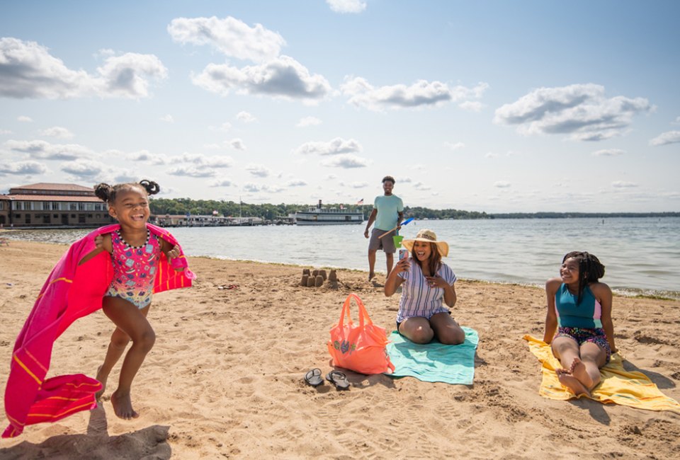 Little girl running on the beach. Photo courtesy of Visit Lake Geneva 