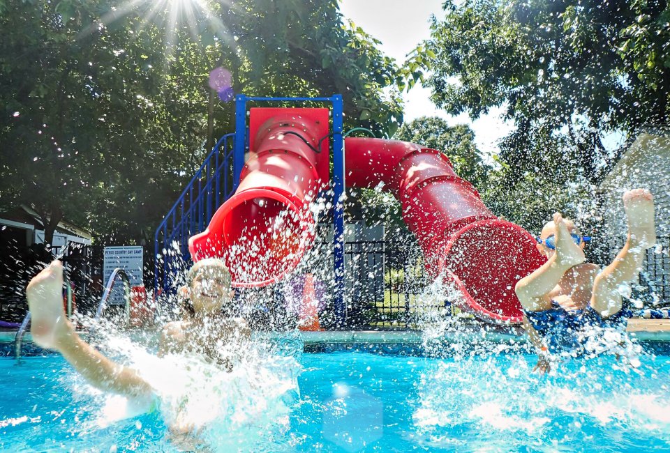 Pierce Day Camp has a pool for every age. Each summer, campers graduate to a deeper pool with more features - like the Double Chute Water Slide at the age 6 pool.