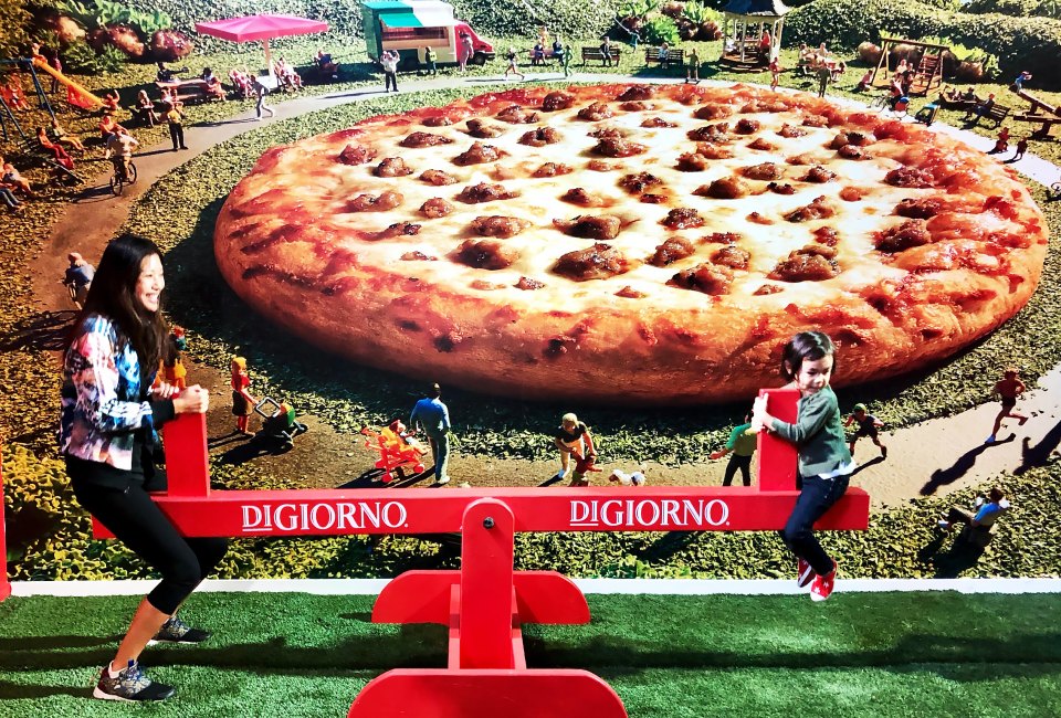 Hop on the seesaw or play corn hole in the DiGiorno Pizza Playground.