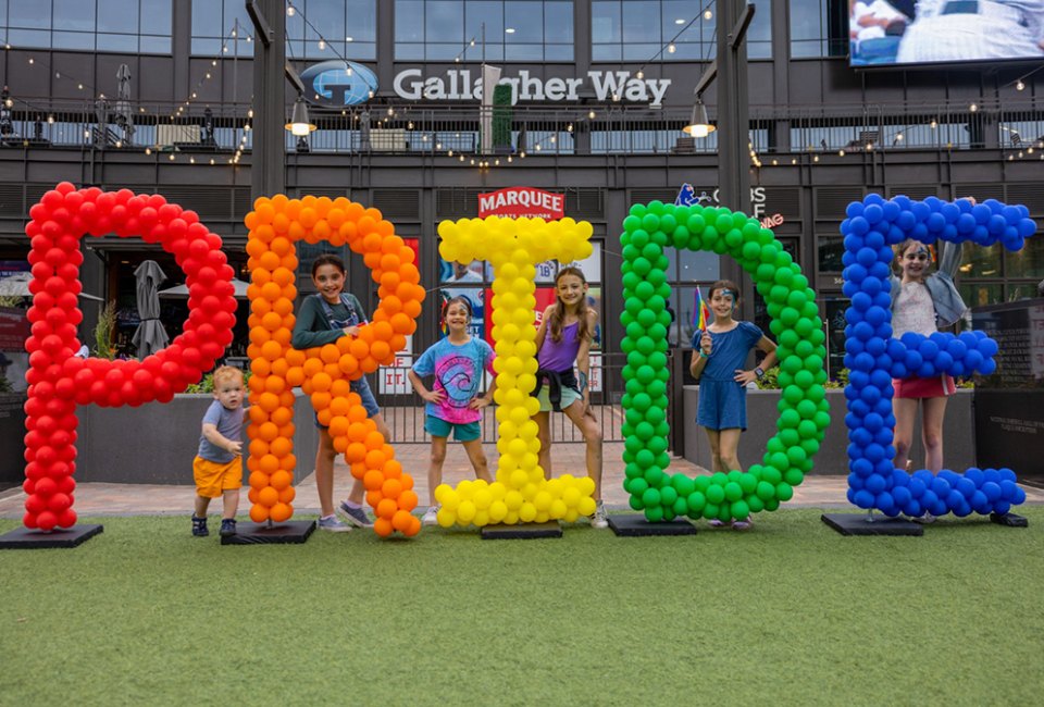 Kids smiling for Pride Month!  Photo courtesy of Gallagher Way