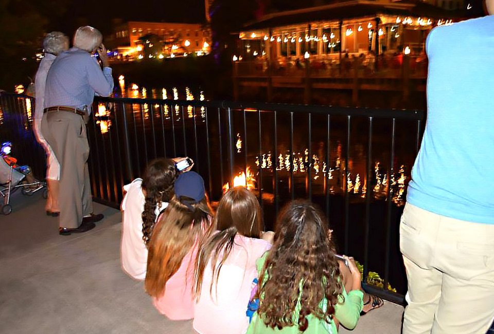Kids settle in after fair activities to watch the River Glow. Photo courtesy of River Glow Pawcatuck
