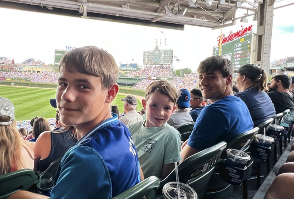 Chicago Cubs fans at Wrigley Field checking of things on their Chicago summer bucket list