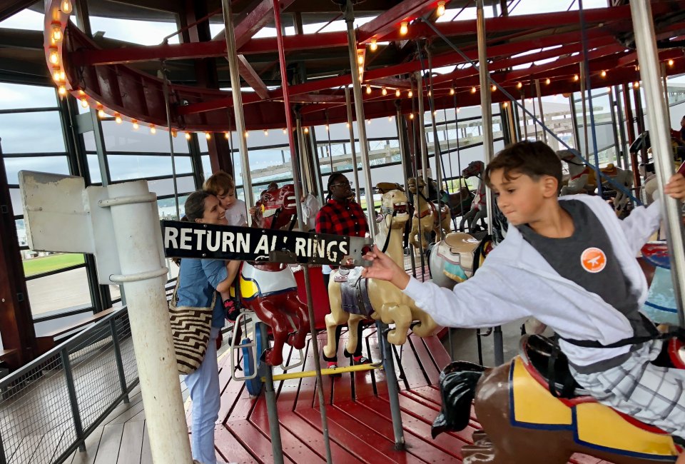 Grab the brass ring and get a free ride at Greenport's carousel. Photo by Jaime Sumersille