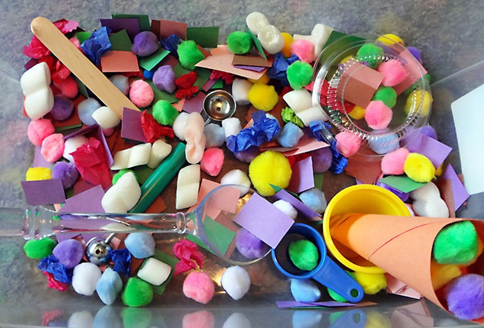 Create a colorful, texturized world with a DIY sensory bin. Photo by Emma Graig