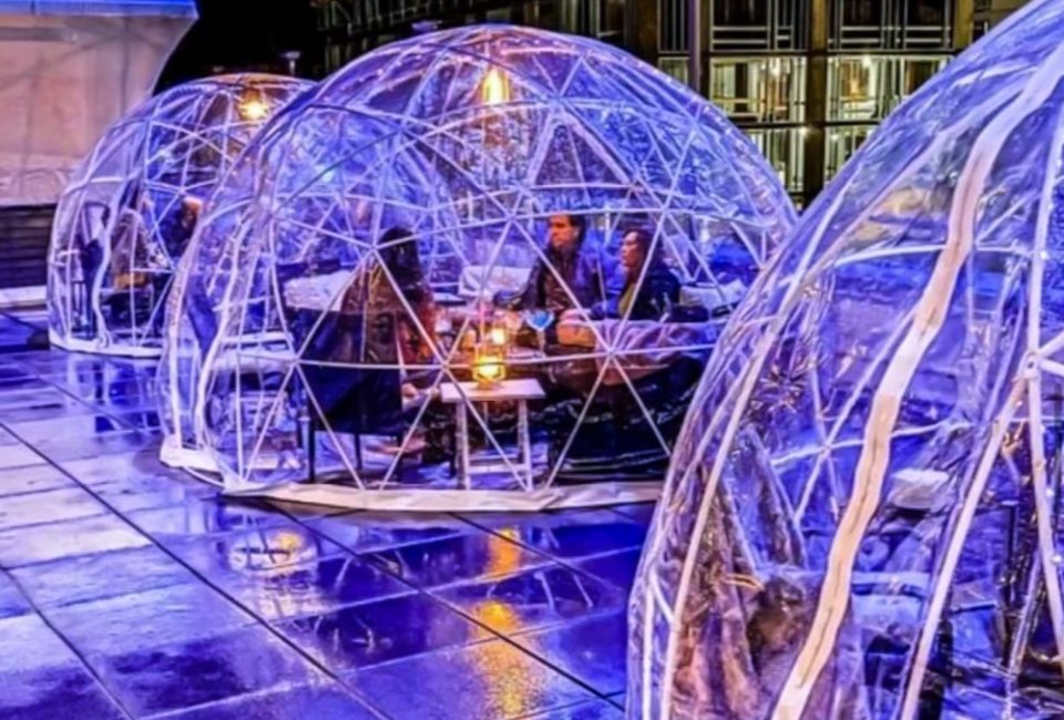 Photo of people eating in geodesic domes in CT