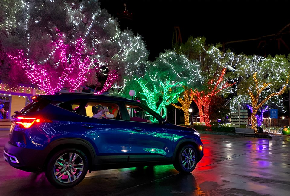Six Flags Holiday in the Park Drive-Thru features more than a million dazzling lights, festive holiday themes, and a seasonal soundtrack.