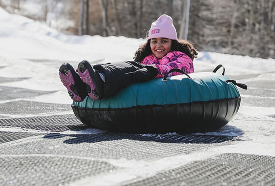 Snow tubers hurtle from top to bottom at exhilarating speeds at Shawnee Mountain Ski Area.