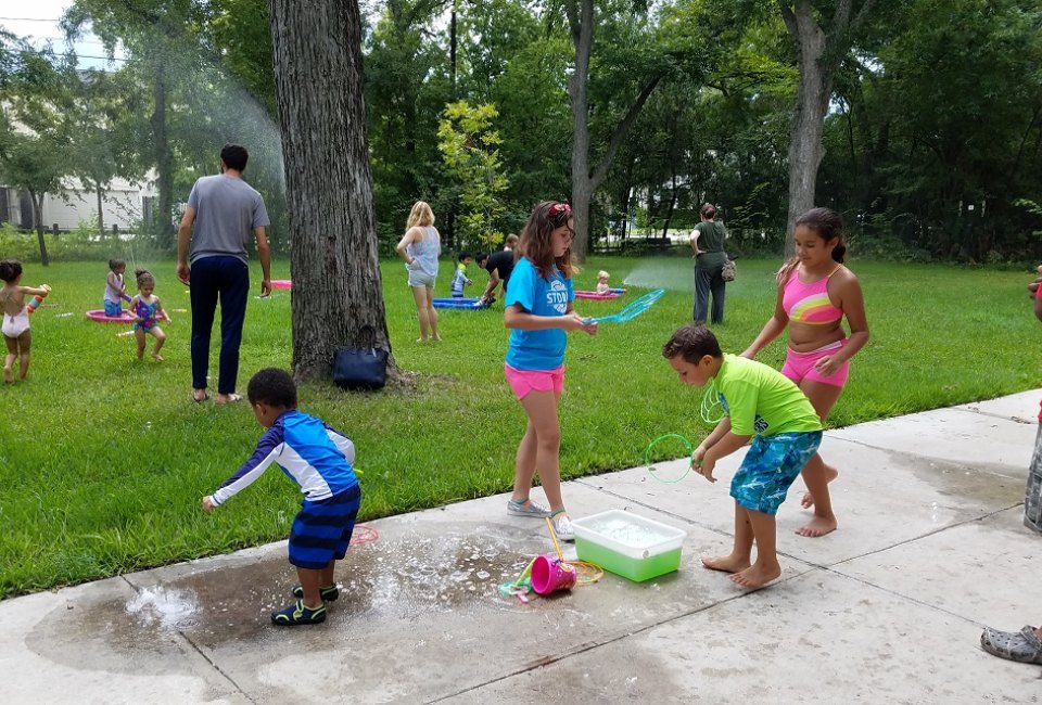 Kids can soak up a little extra fun in the sun during the Discovery Center's Sprinkler Day. Photo courtesy of Nature Discovery Center. 